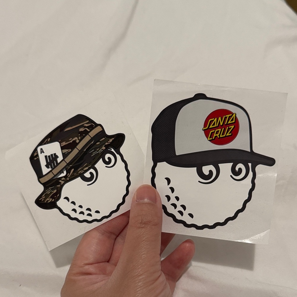 Set of two Malbon golf ball stickers